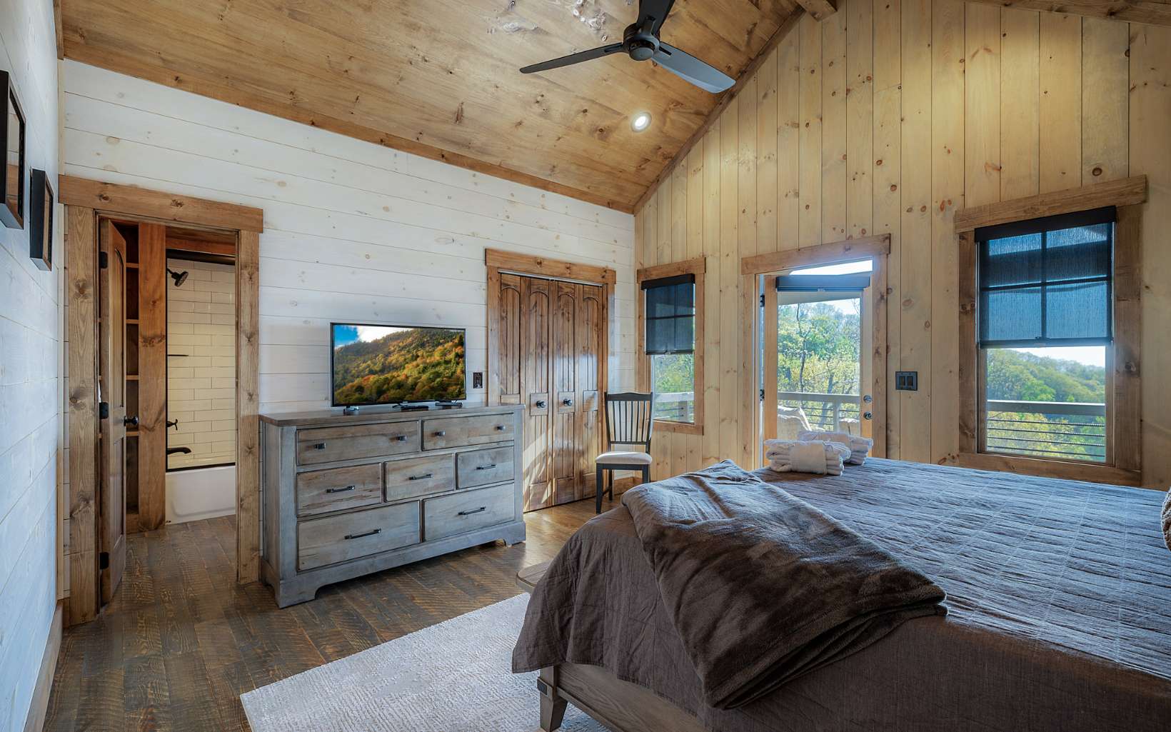 814 Overlook Drive Blue Ridge, GA 30513 - Photo 27 of 53 a spacious bedroom with a bed and a dresser