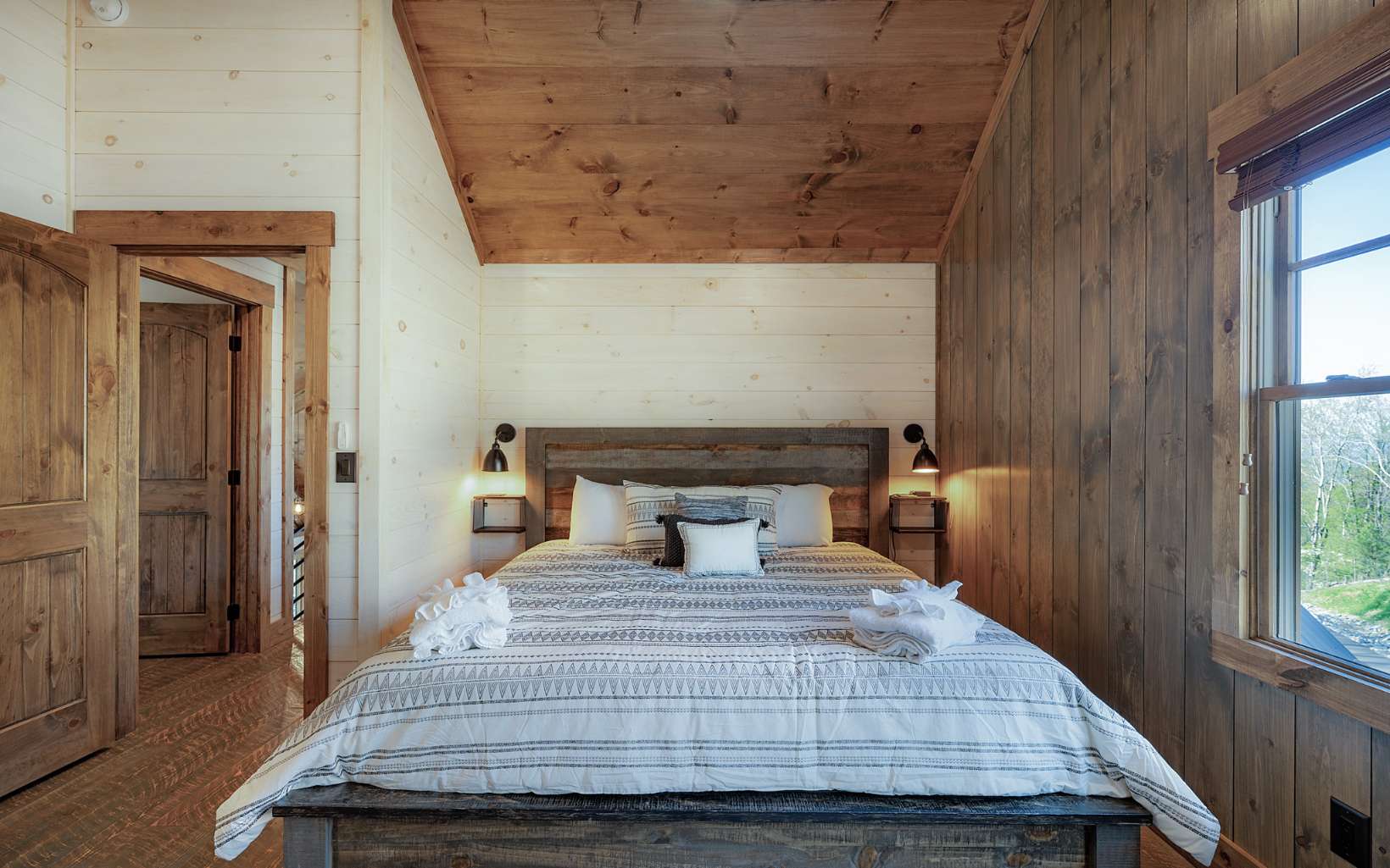 814 Overlook Drive Blue Ridge, GA 30513 - Photo 30 of 53 a bedroom with a bed and wooden floor