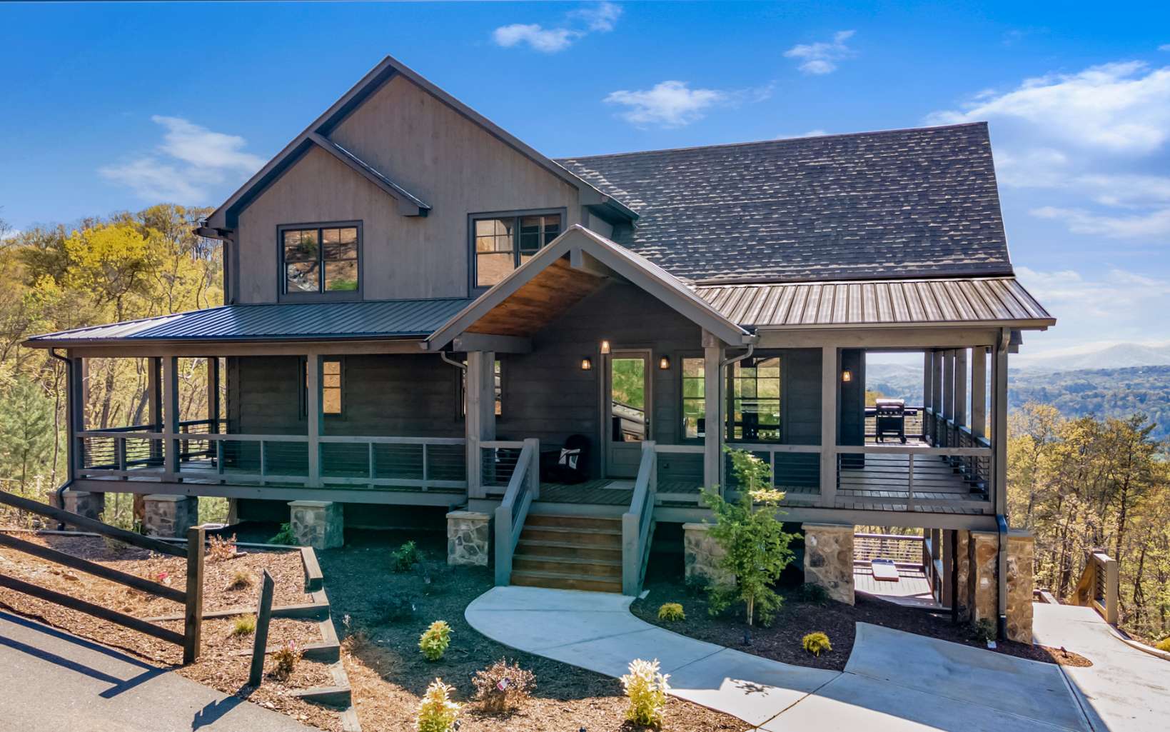814 Overlook Drive Blue Ridge, GA 30513 - Photo 4 of 53 a front view of a house with garden