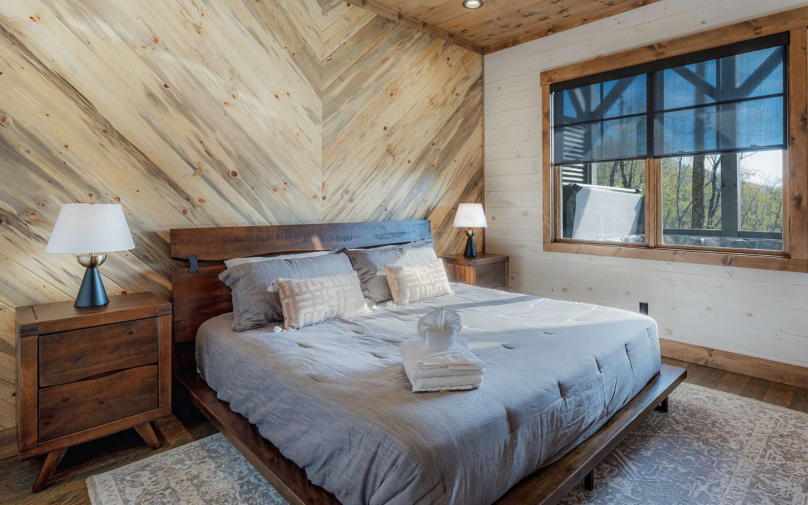 814 Overlook Drive Blue Ridge, GA 30513 - Photo 45 of 53 a large bed sitting in a bedroom next to a window