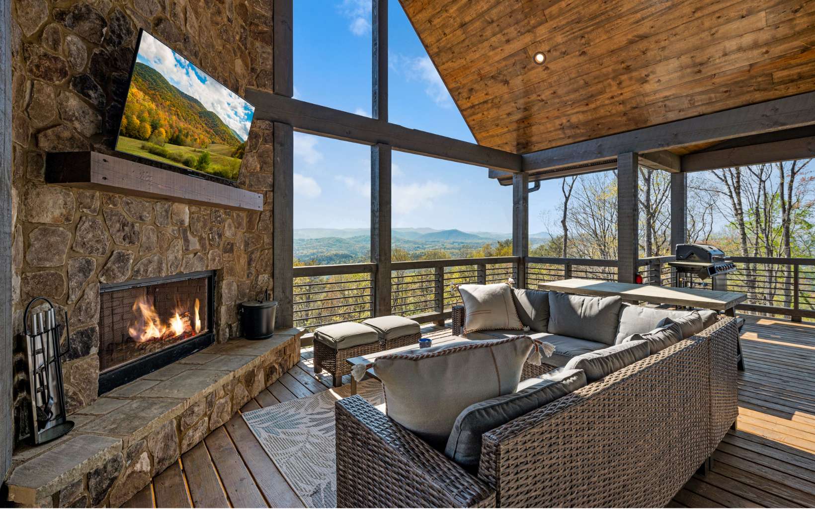 814 Overlook Drive Blue Ridge, GA 30513 - Photo 7 of 53 a living room with furniture a fireplace and a floor to ceiling window