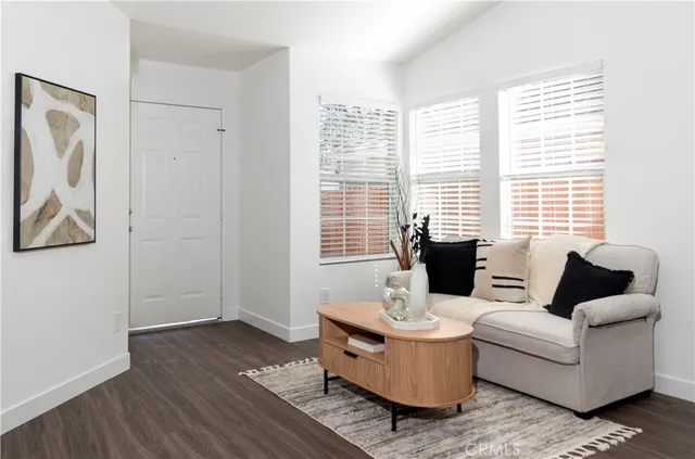 a living room with furniture and windows