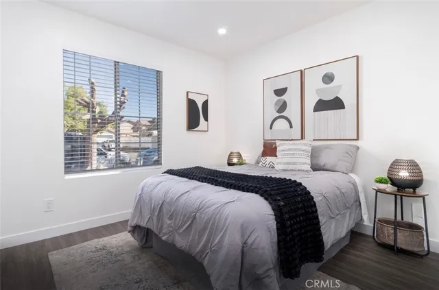 a bedroom with bed and a window