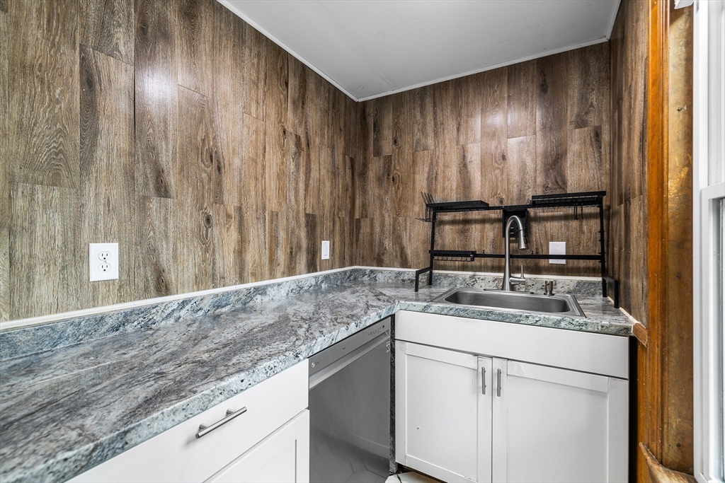 4 State Street, Unit 4 Milford, MA 01757 - Photo 9 of 23 a bathroom with a sink and a mirror