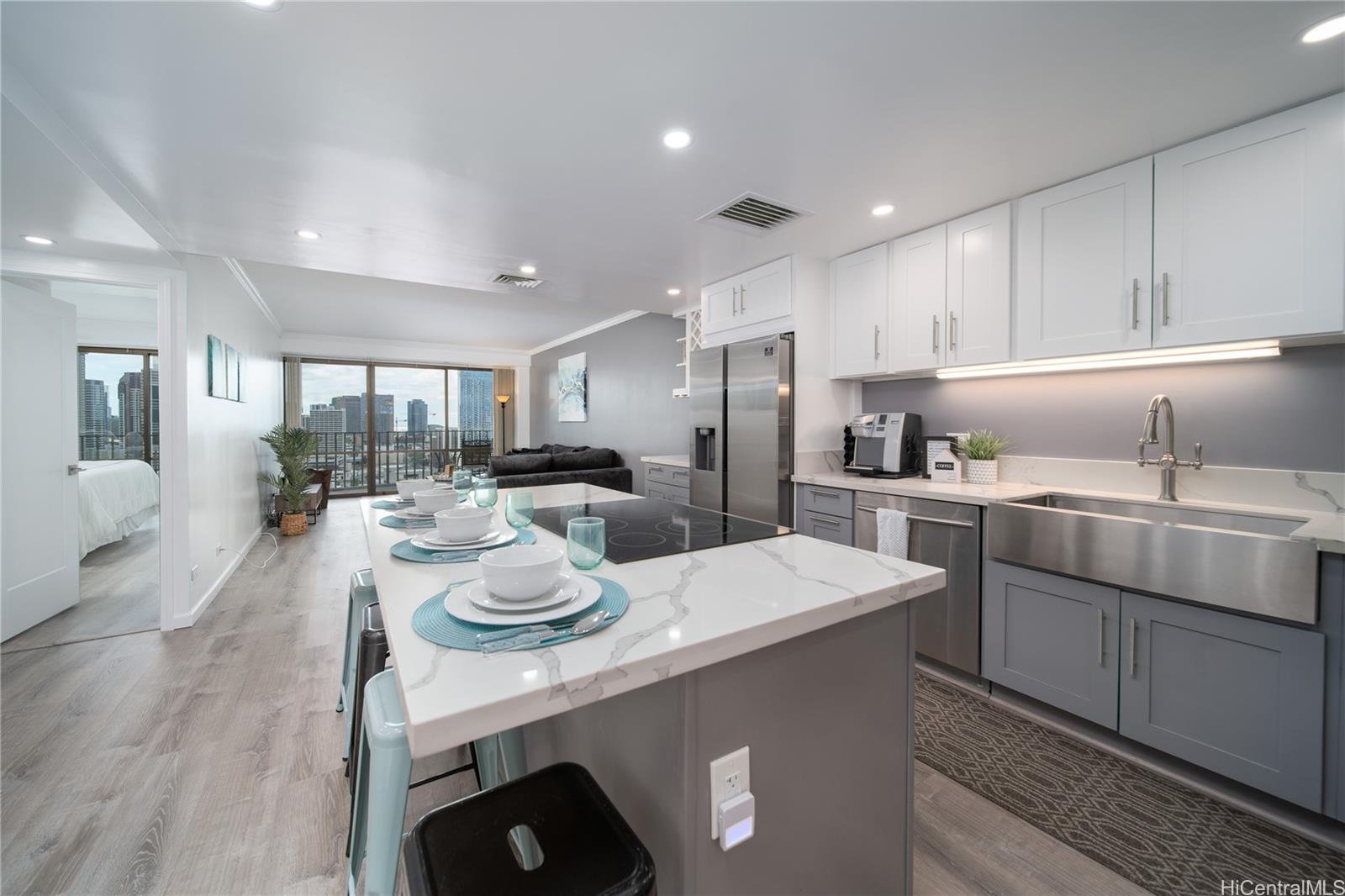 a kitchen with sink refrigerator and cabinets