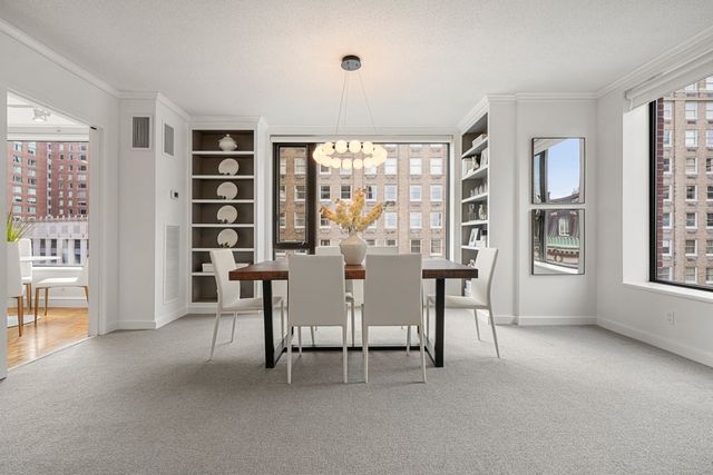 a view of a livingroom with furniture and a window