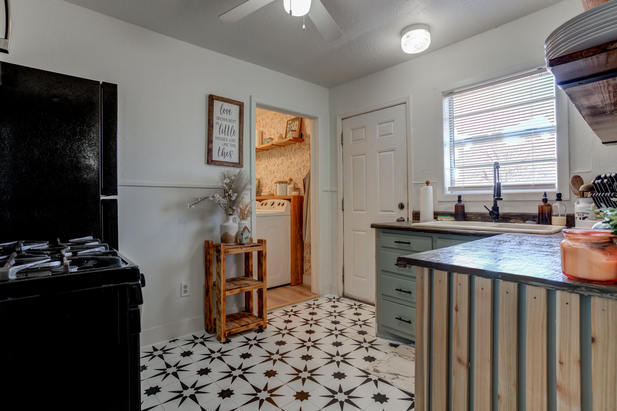 300 Aileen Street Plainview, TX 79072 - Photo 12 of 28 a kitchen with a sink stove and refrigerator