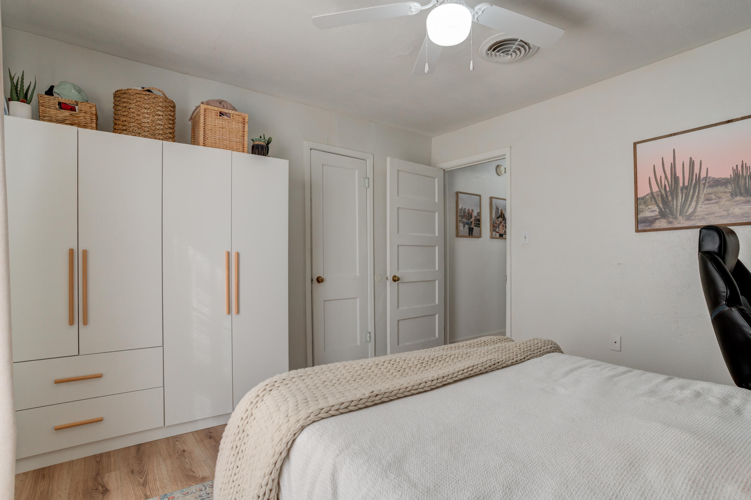 300 Aileen Street Plainview, TX 79072 - Photo 23 of 28 a bedroom with a bed and a refrigerator