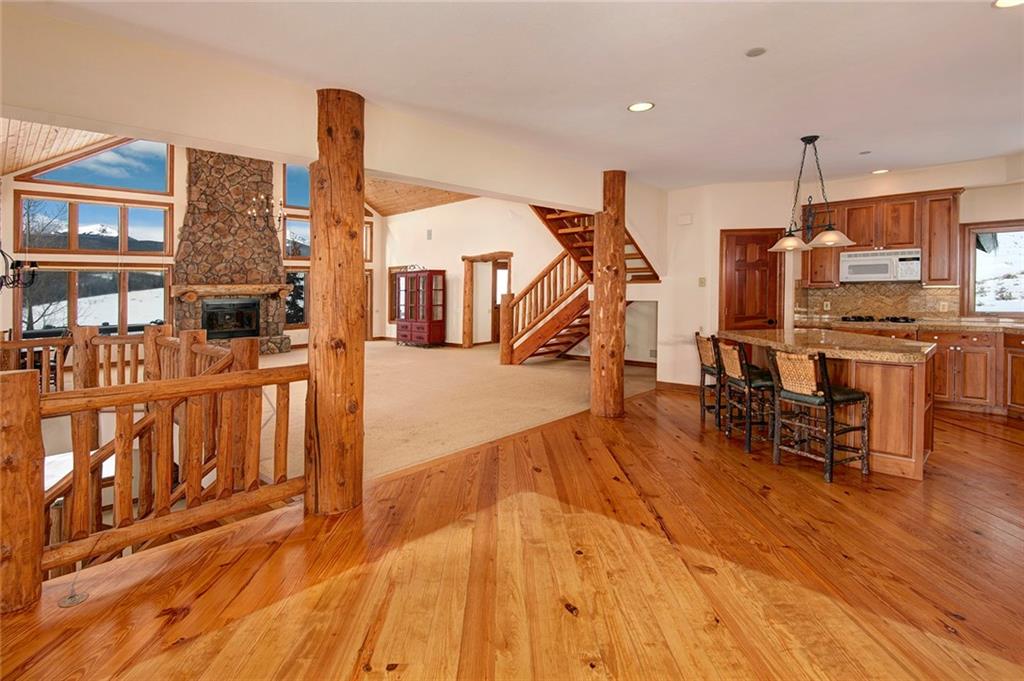 731 Pioneer Creek Road Silverthorne, CO 80498 - Photo 16 of 32 a view of a living room and kitchen with furniture and wooden floor