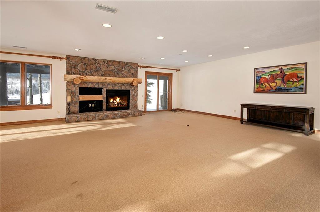 731 Pioneer Creek Road Silverthorne, CO 80498 - Photo 19 of 32 a view of a livingroom with a fireplace and window
