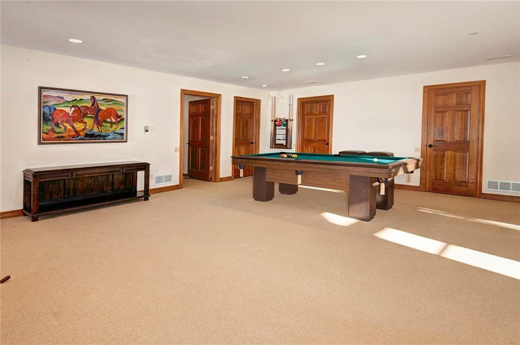731 Pioneer Creek Road Silverthorne, CO 80498 - Photo 20 of 32 a living room with furniture a pool table and a couch