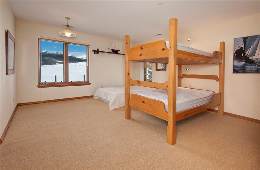 731 Pioneer Creek Road Silverthorne, CO 80498 - Photo 21 of 32 a view of an empty room with a window and a room