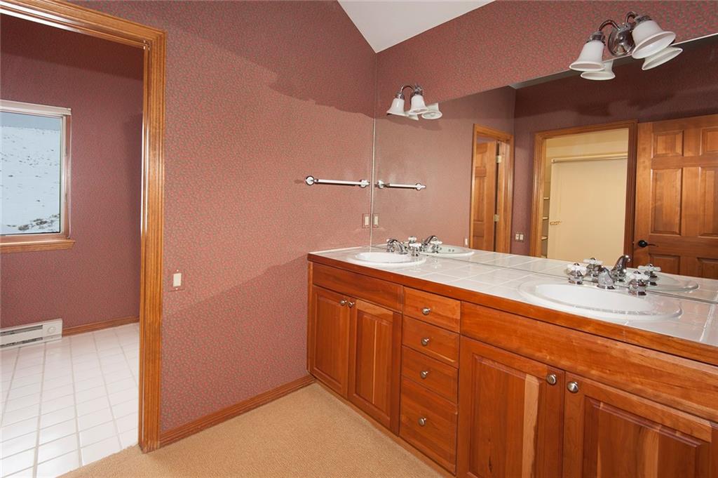 731 Pioneer Creek Road Silverthorne, CO 80498 - Photo 26 of 32 a bathroom with a double vanity sink and a mirror