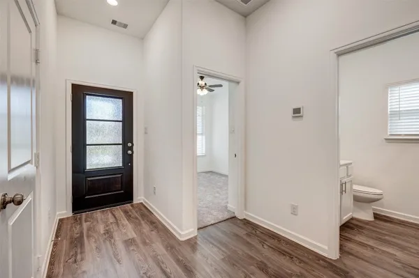 a view of a livingroom with a chandelier fan