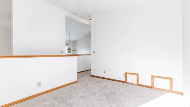 a view of a room with cabinet and mirror