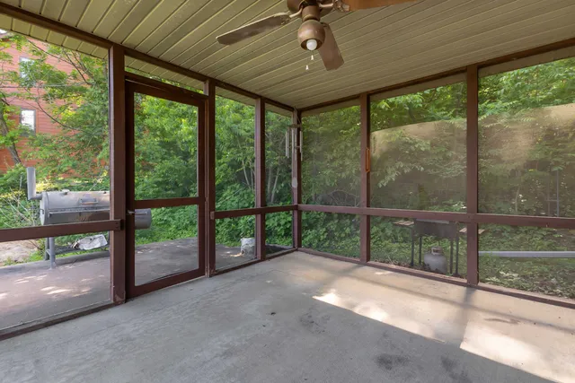 a view of a porch with a floor to ceiling window