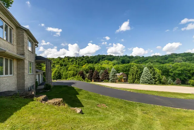 a view of a fountain in front of a house