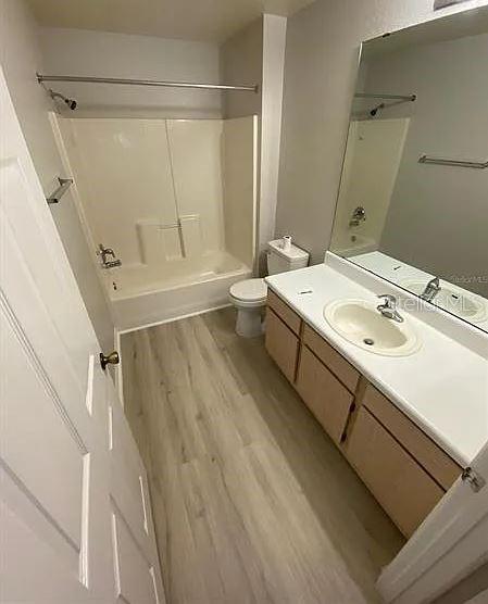5455 Vineland Road, Unit 3108 Orlando, FL 32811 - Photo 13 of 17 a bathroom with a sink a toilet and a shower