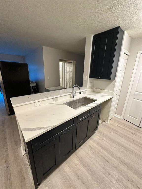 5455 Vineland Road, Unit 3108 Orlando, FL 32811 - Photo 5 of 17 a bathroom with a sink double vanity granite and a mirror