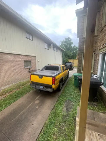 a backyard of a house with yard and outdoor seating