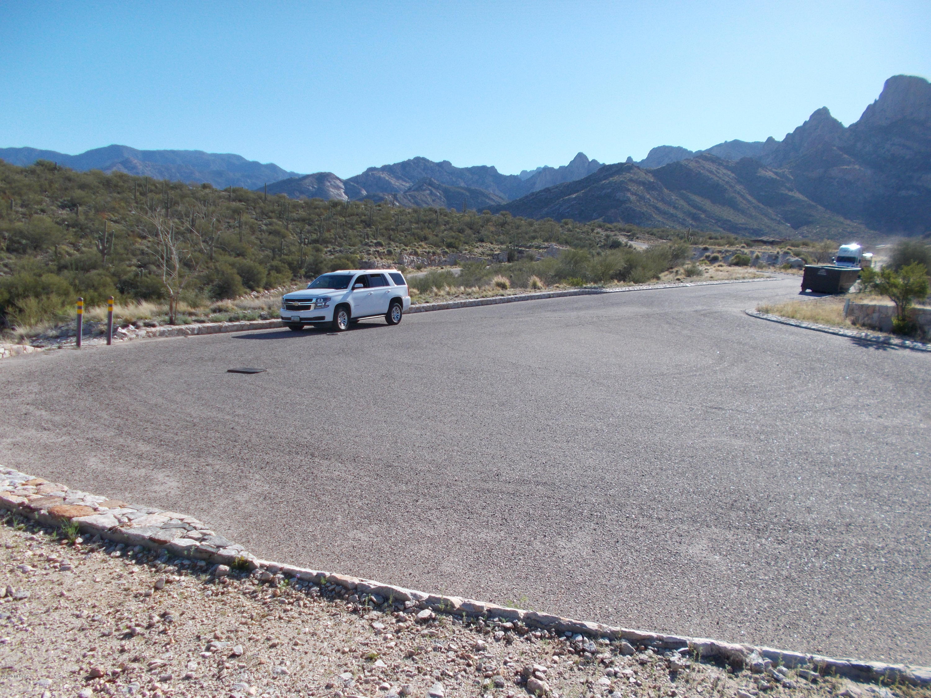 2280 Della Roccia Court, Unit 19 Oro Valley, AZ 85737 - Photo 4 of 20 a car parked on the side of a road