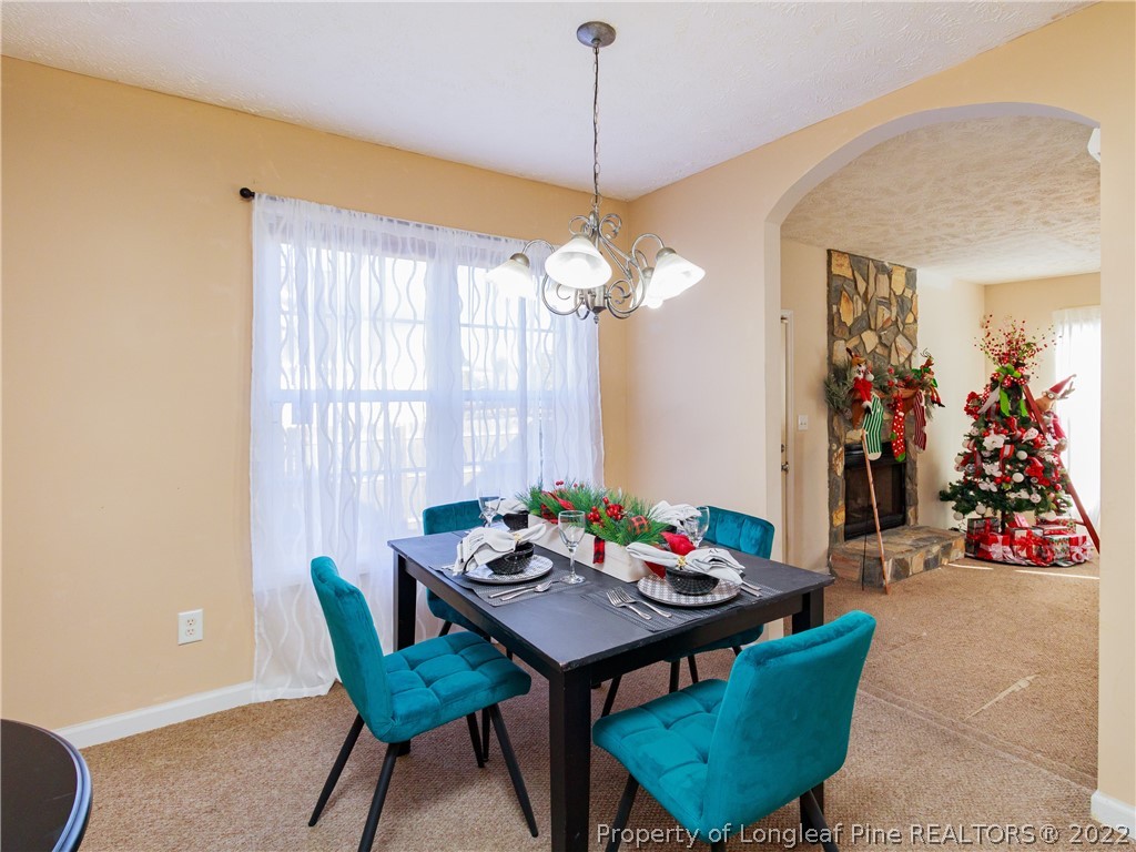 516 Kernstown Road Raeford, NC 28376 - Photo 8 of 20 a view of a dining room with furniture and chandelier