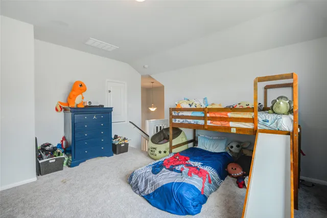 a bathroom with a sink mirror and toilet