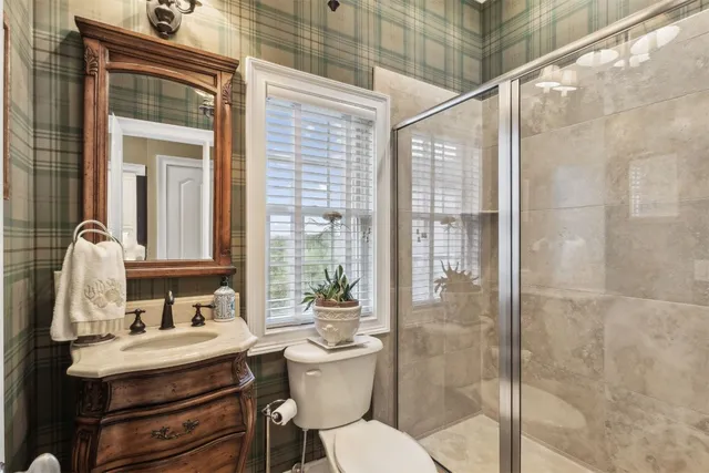 a view of a palm plant from a balcony