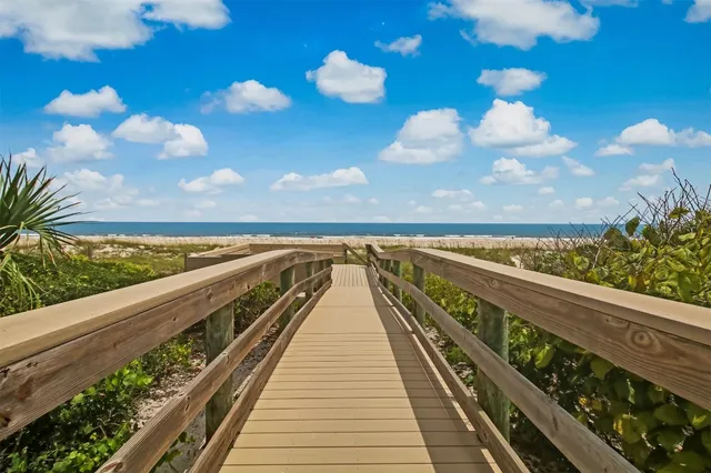 a view of balcony with wooden floor