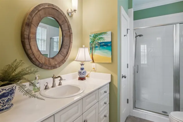 a kitchen with stainless steel appliances white cabinets and a refrigerator