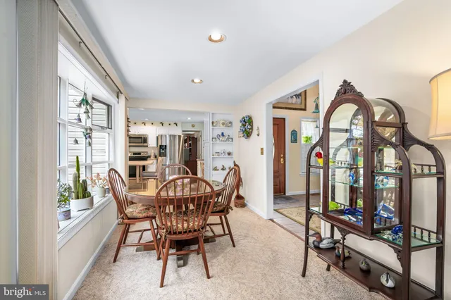 a view of a livingroom with furniture and a window