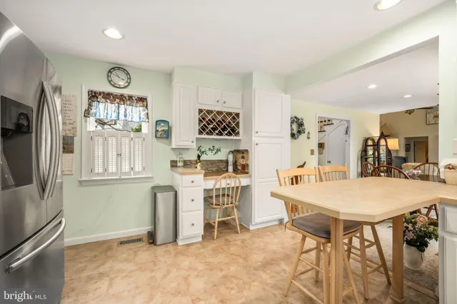 a view of kitchen with furniture and wooden floor