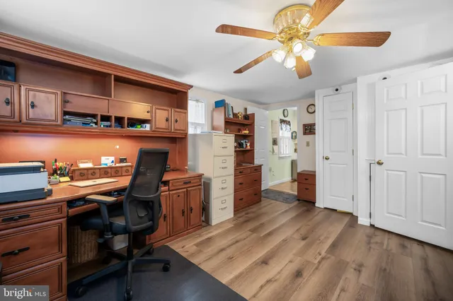 a view of a workspace with furniture