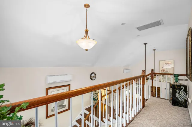 a view of a hallway with a chandelier