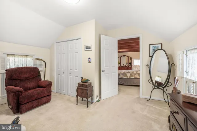 a livingroom with furniture and a large window