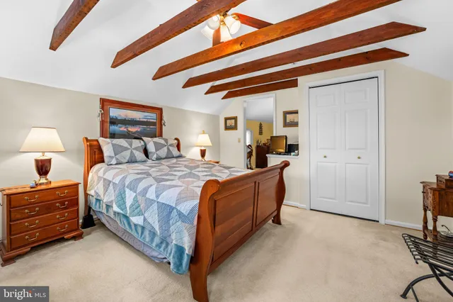 a bed room with a bed and a lamp