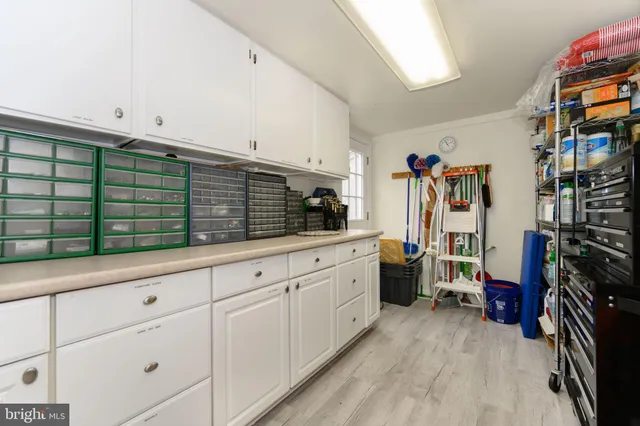 a kitchen with stainless steel appliances cabinets and a window