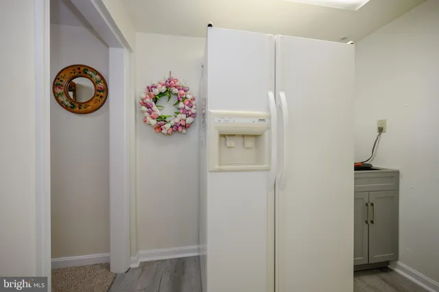 a bedroom with bed cabinet and window
