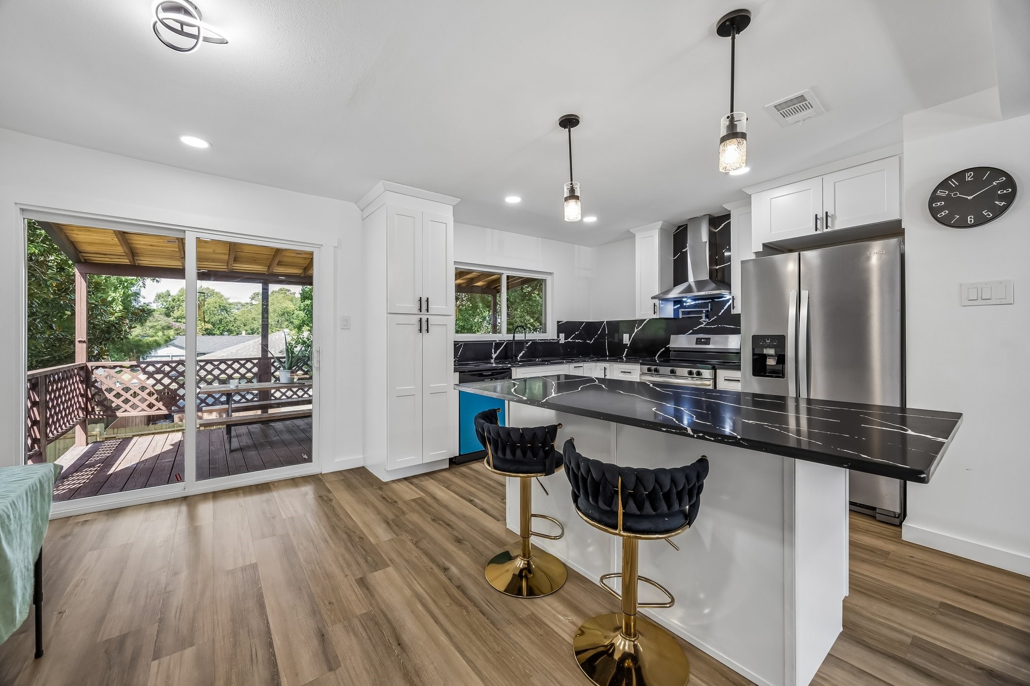 23319 Whispering Willow Drive Spring, TX 77373 - Photo 2 of 31 This beautiful modern contemporary open style kitchen has been updated with new stainless steel appliances, New cabinets and calcutta black quartz countertops and island countertop.
