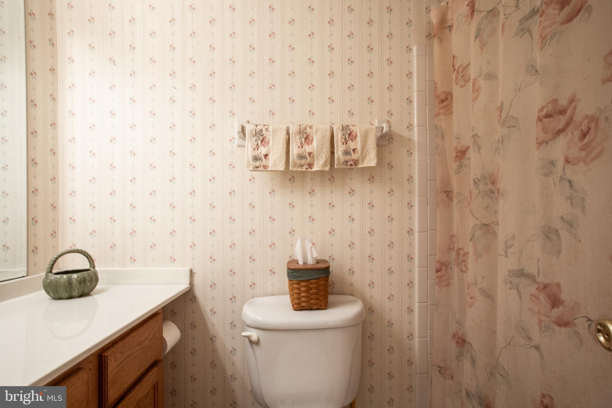 34 Kelly Court Hamilton, NJ 08690 - Photo 21 of 31 a bathroom with a sink a toilet and shower