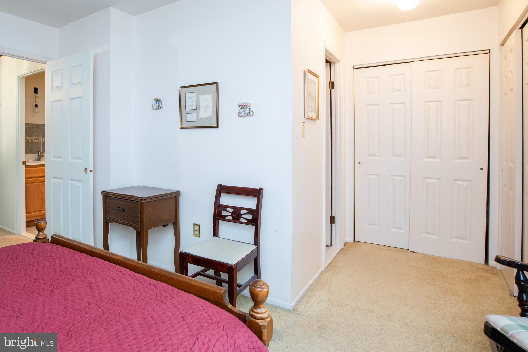 34 Kelly Court Hamilton, NJ 08690 - Photo 23 of 31 a bedroom with a bed a table and painting on the wall