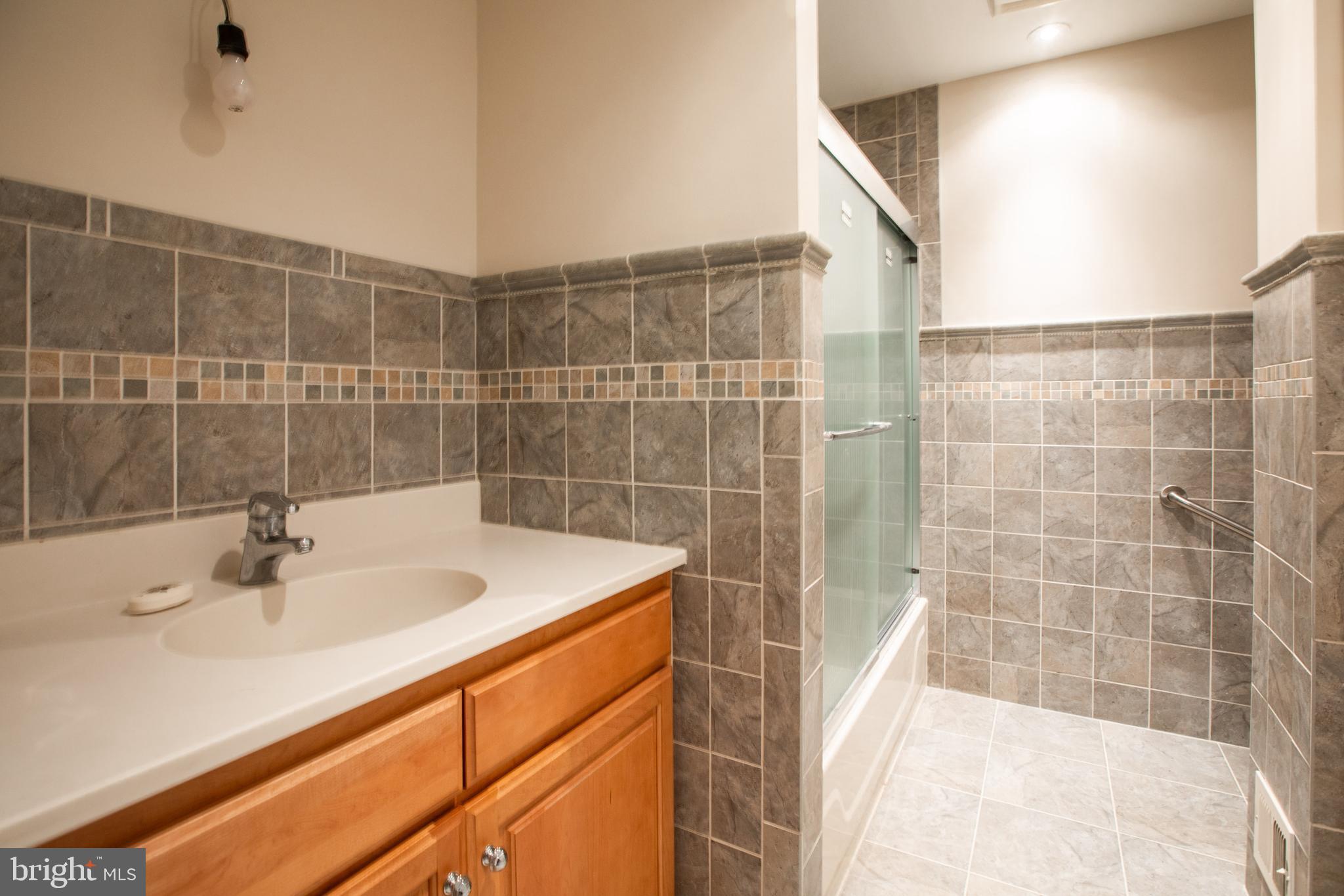 34 Kelly Court Hamilton, NJ 08690 - Photo 25 of 31 a bathroom with a sink and a shower