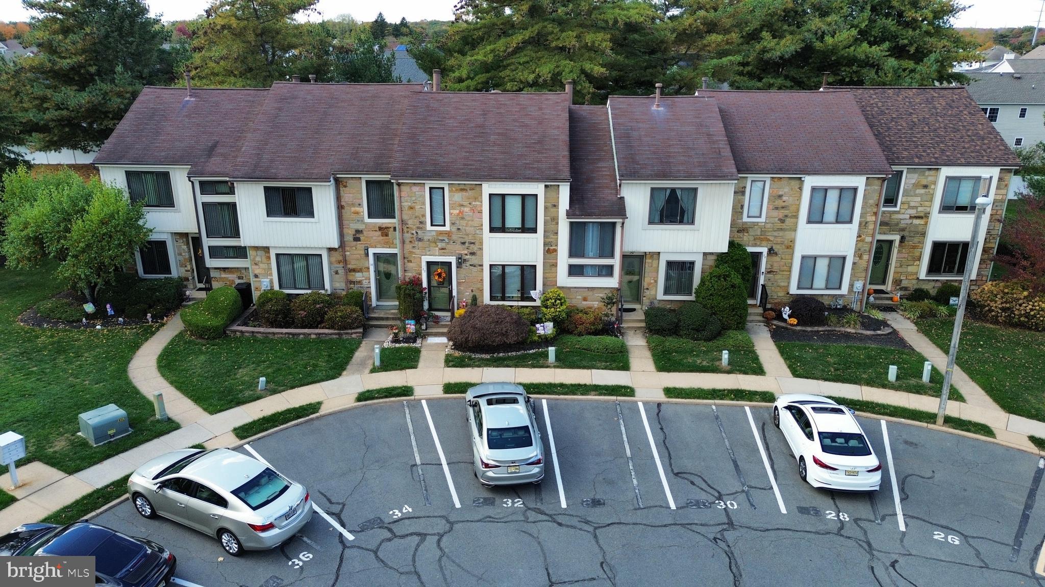 34 Kelly Court Hamilton, NJ 08690 - Photo 28 of 31 a view of a patio with couches table and chairs with wooden fence
