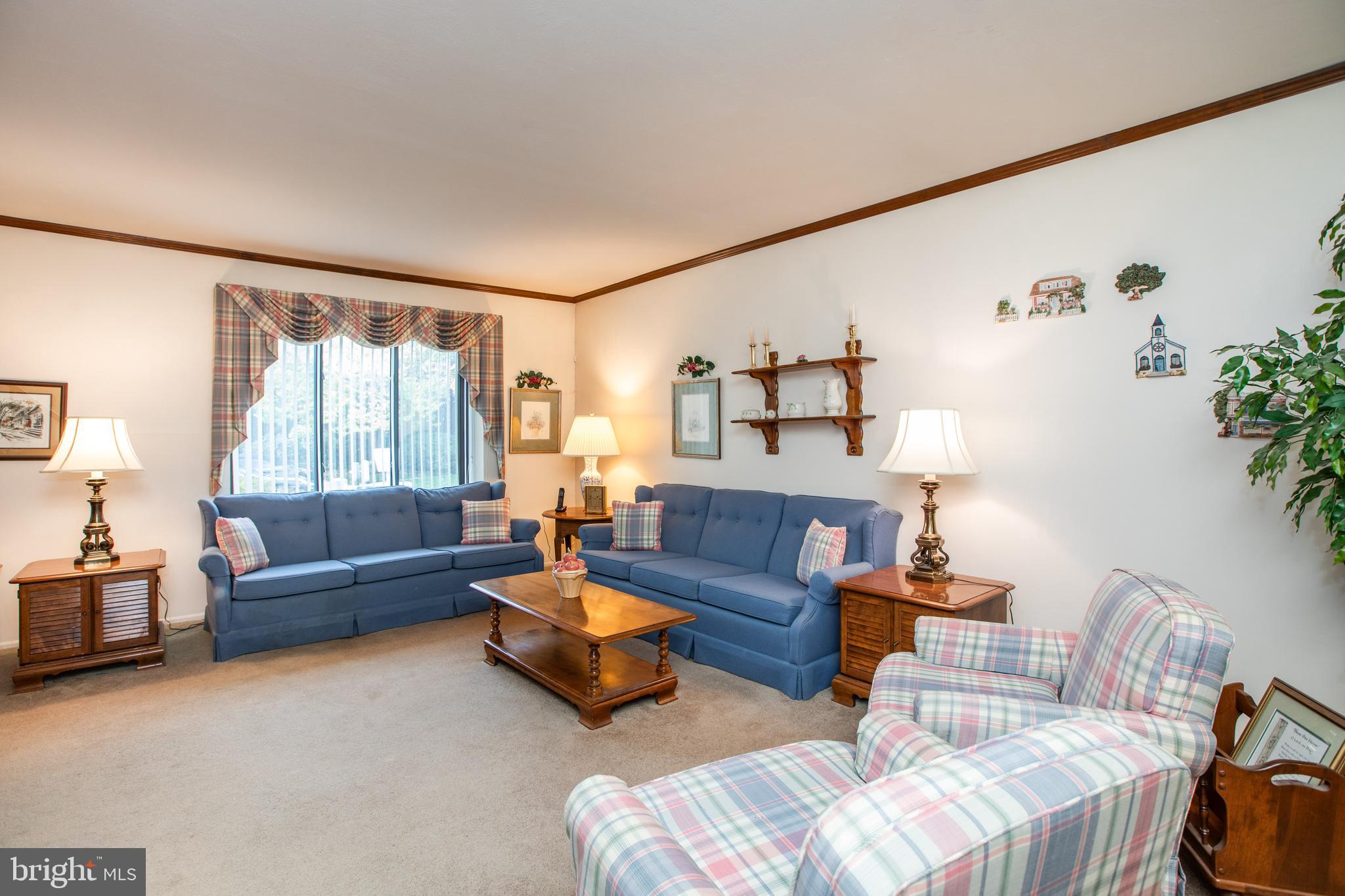 34 Kelly Court Hamilton, NJ 08690 - Photo 4 of 31 a living room with furniture and a large window