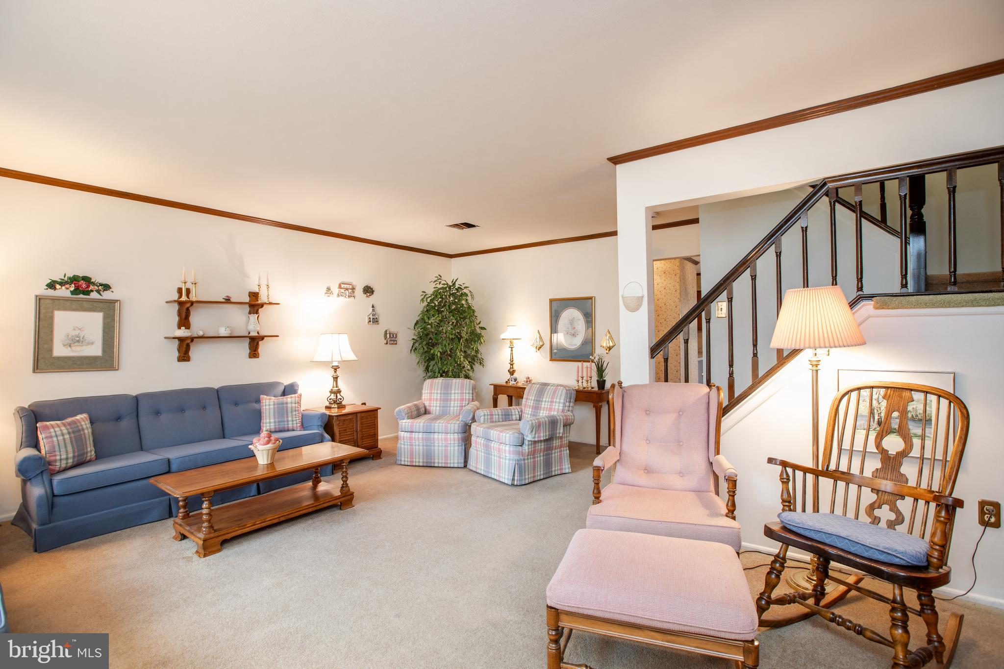 34 Kelly Court Hamilton, NJ 08690 - Photo 5 of 31 a living room with furniture and a large window