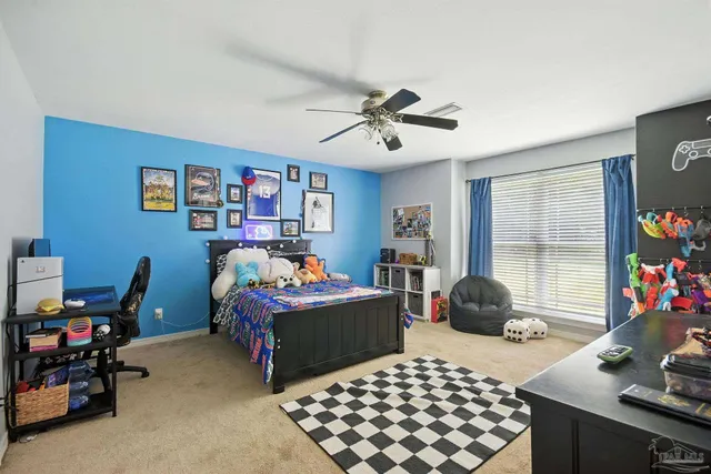 a view of a house with backyard and trees