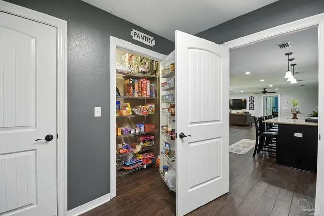 an aerial view of a house with garden space and lake view