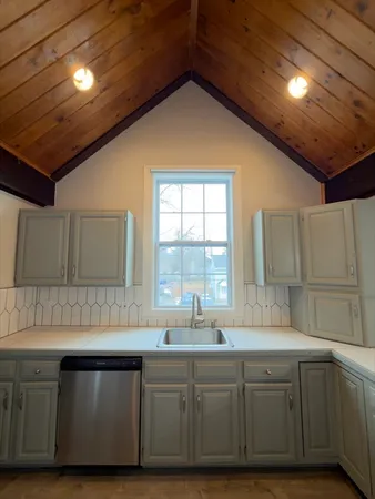 a kitchen with sink and window