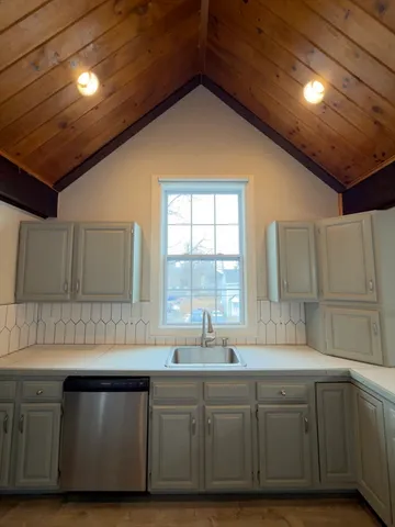 a kitchen with sink and window