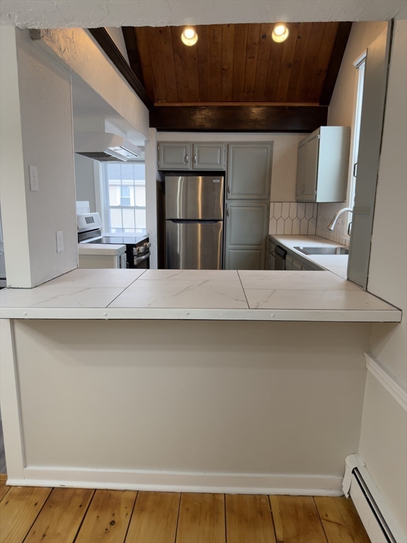41 Sherman Street, Unit 2 Foxboro, MA 02035 - Photo 5 of 21 a kitchen with a refrigerator and a sink